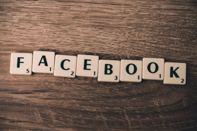 Facebook spelled in scrabble tiles