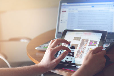 Shopping online with iPad on a mobile responsive eCommerce site
