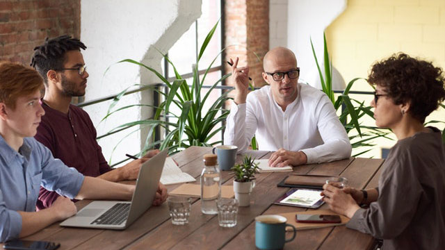 Project Management Team at table